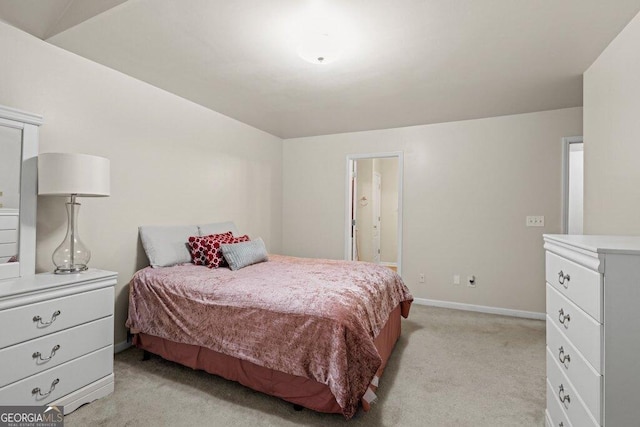 bedroom featuring light carpet