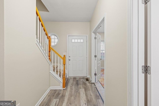 foyer entrance with light hardwood / wood-style flooring