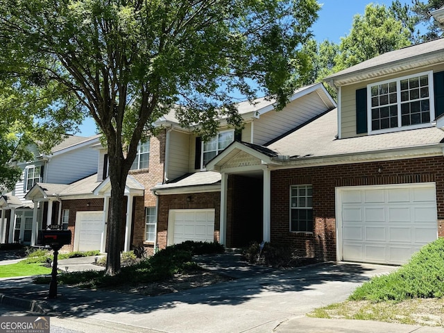 townhome / multi-family property featuring a garage