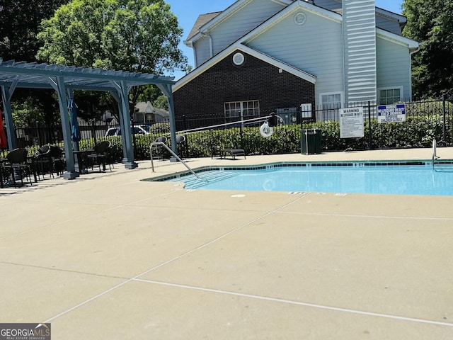 view of pool with a pergola