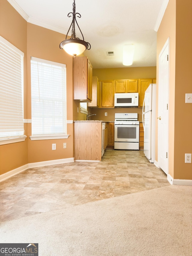 kitchen with crown molding, white appliances, decorative light fixtures, and light colored carpet