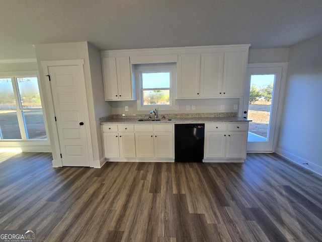 kitchen featuring dark wood-type flooring, sink, white cabinetry, dishwasher, and light stone countertops