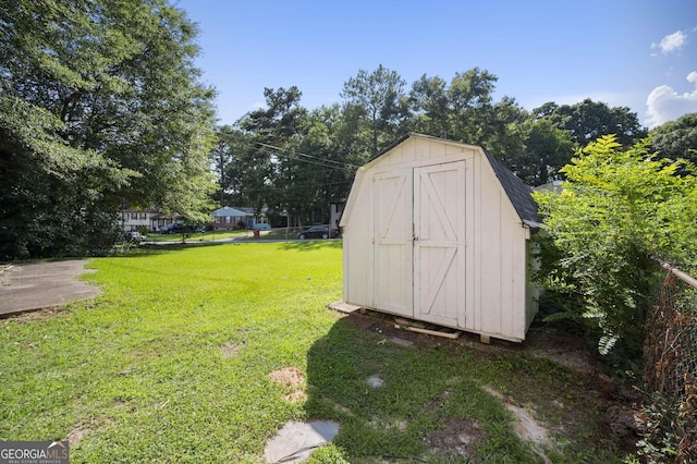 view of outdoor structure with a yard