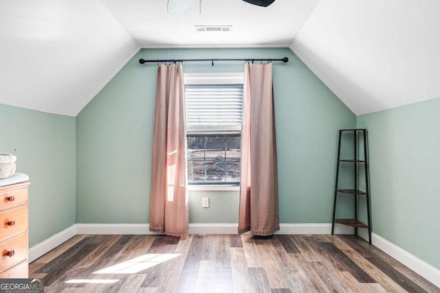 bonus room with hardwood / wood-style flooring, vaulted ceiling, and ceiling fan