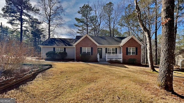 ranch-style home featuring a front yard and a porch