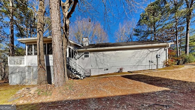 rear view of house with a sunroom