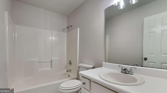 full bathroom featuring vanity, shower / washtub combination, and toilet