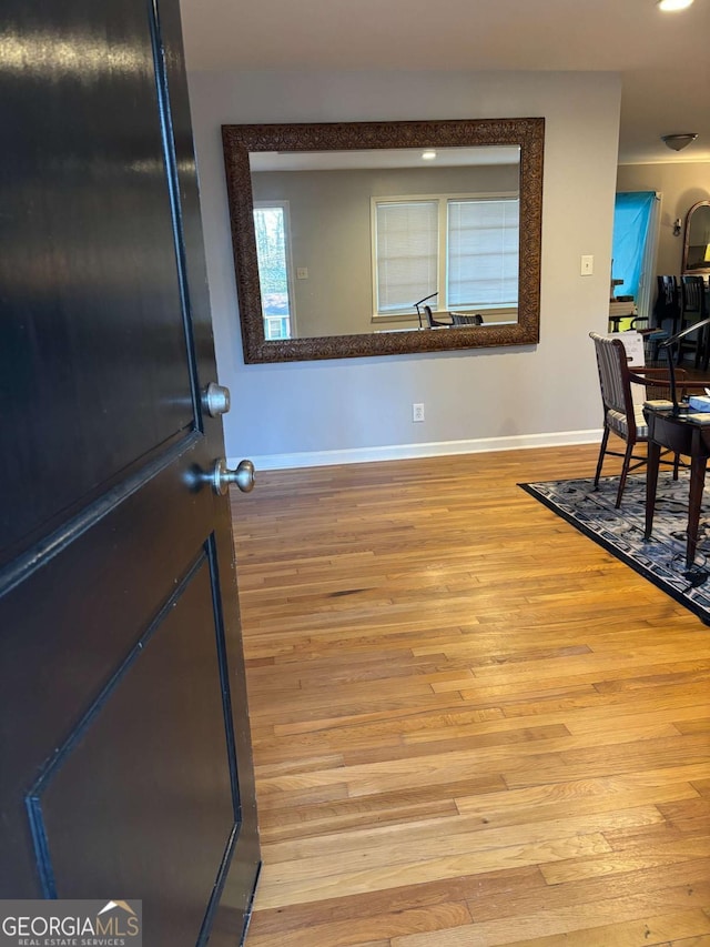 interior space with light wood-style floors and baseboards