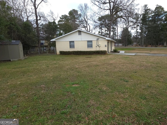 view of property exterior with a yard and a shed