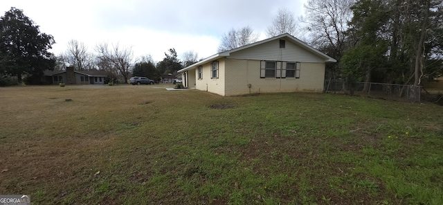 view of home's exterior featuring a yard