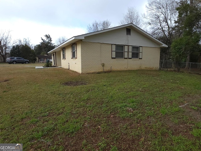 view of home's exterior featuring a lawn