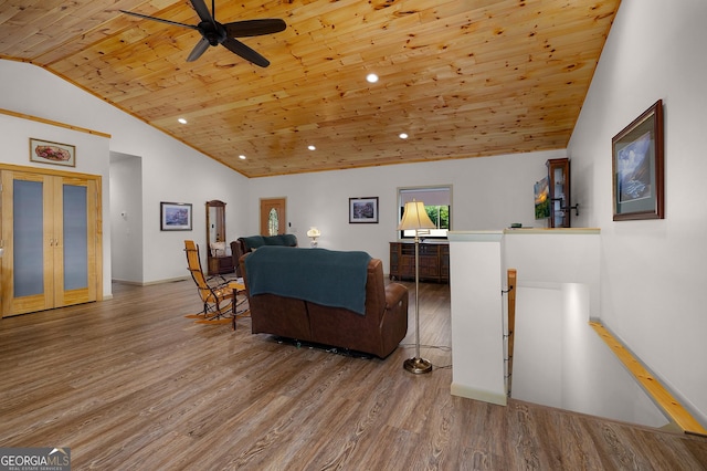 living room featuring hardwood / wood-style floors, lofted ceiling, ceiling fan, wood ceiling, and french doors