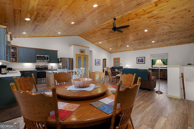 dining area featuring lofted ceiling, wood ceiling, light hardwood / wood-style floors, and ceiling fan