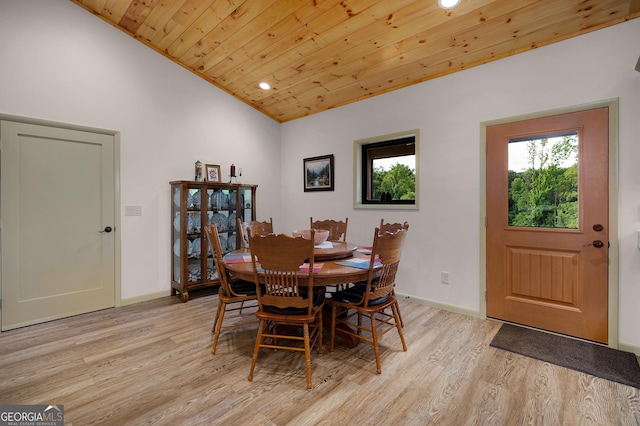 dining area featuring lofted ceiling, wooden ceiling, and light wood-type flooring