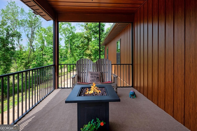 view of patio with a fire pit