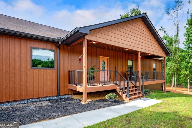 1581 Taylor Town Rd NE, Ranger, GA 30734 - view of front of property with covered porch, a front yard, and a shingled roof