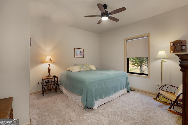 bedroom with ceiling fan and carpet