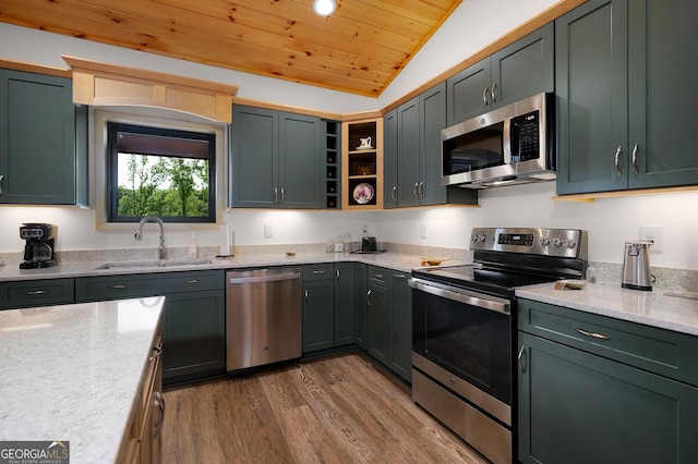 kitchen with sink, wood ceiling, appliances with stainless steel finishes, hardwood / wood-style floors, and vaulted ceiling