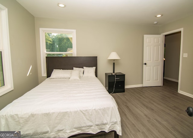 bedroom featuring recessed lighting, baseboards, and wood finished floors