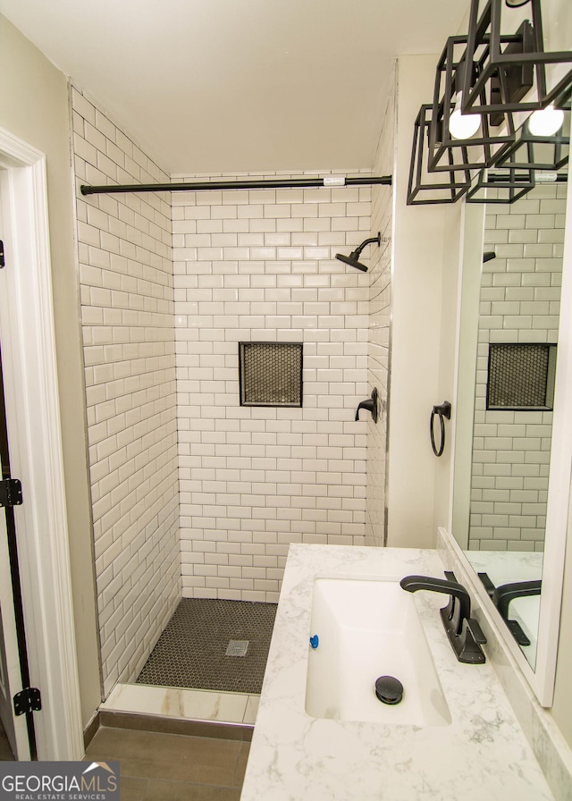 bathroom featuring vanity and a shower stall