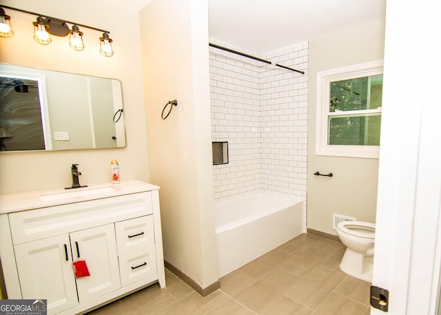 full bath featuring vanity, toilet, baseboards, and visible vents