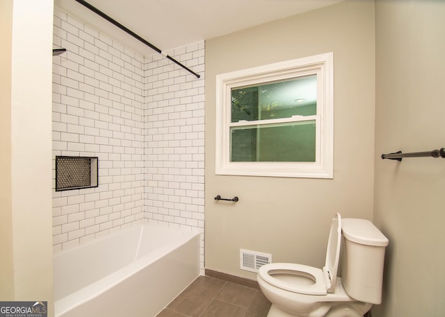 full bath with visible vents, baseboards, toilet, and bathtub / shower combination