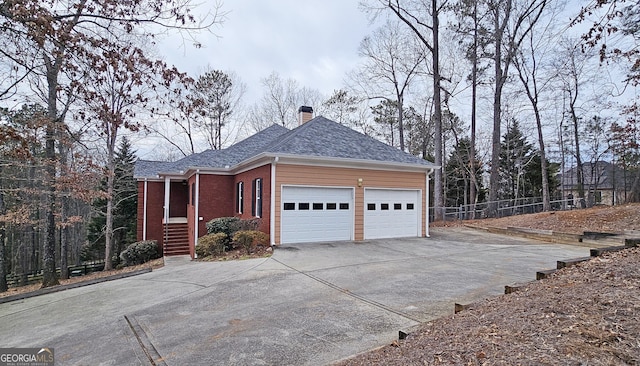 view of side of property featuring a garage