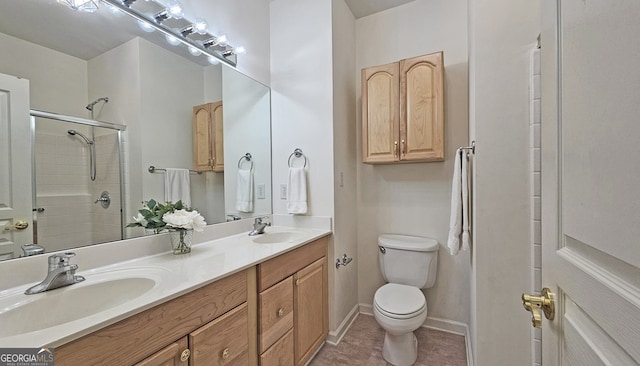 bathroom with walk in shower, tile patterned floors, vanity, and toilet