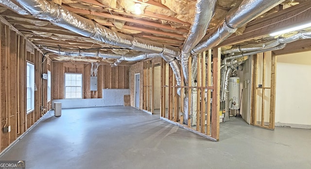 basement with electric panel and water heater