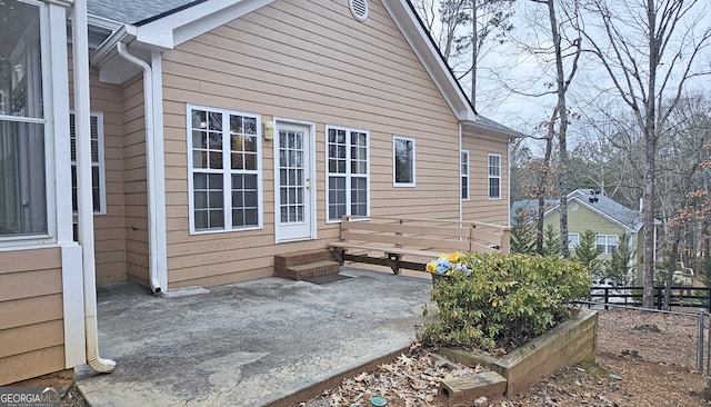 view of side of home with a patio area