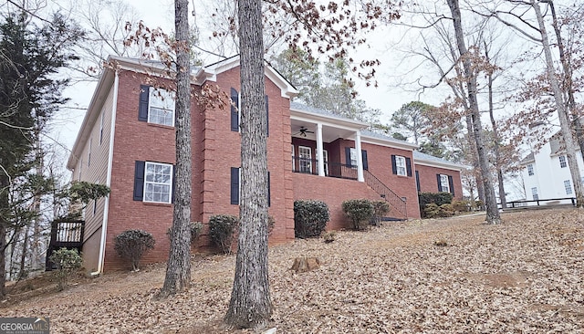 view of side of property featuring ceiling fan