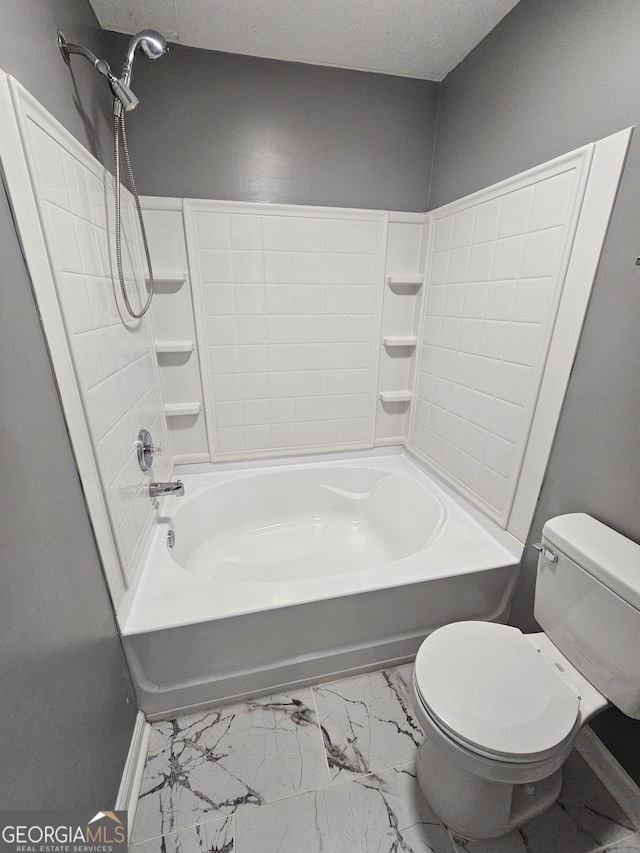 bathroom with shower / bathtub combination, toilet, and a textured ceiling