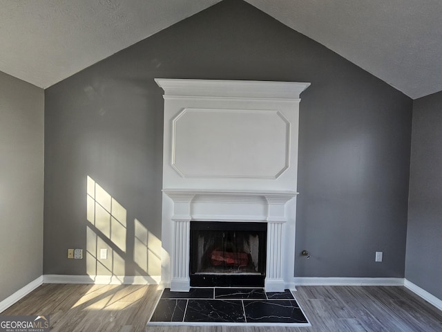 interior details featuring hardwood / wood-style floors and a textured ceiling