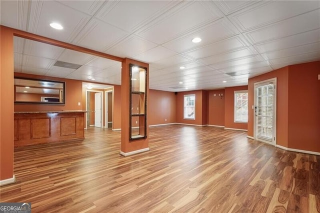 unfurnished living room featuring wood-type flooring