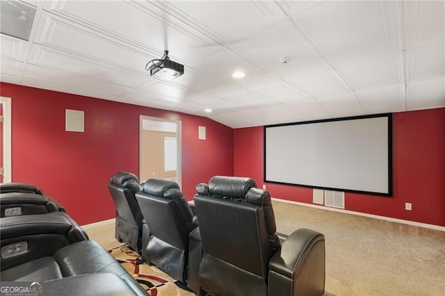 carpeted home theater room featuring lofted ceiling