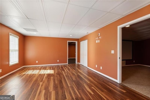 empty room with dark hardwood / wood-style floors