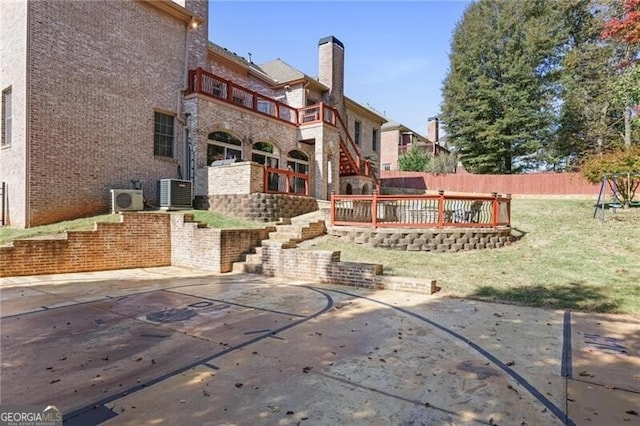 exterior space with cooling unit, a balcony, and ac unit