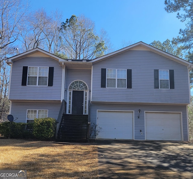 split foyer home featuring a garage