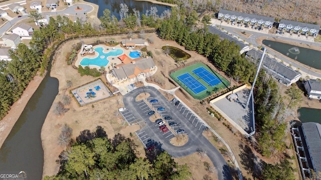 birds eye view of property with a water view