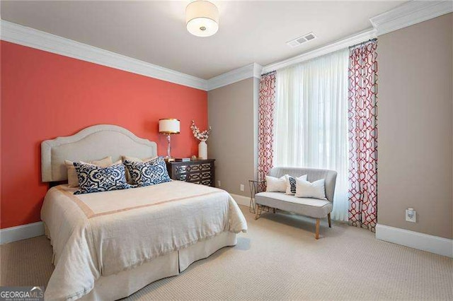 bedroom featuring crown molding and carpet