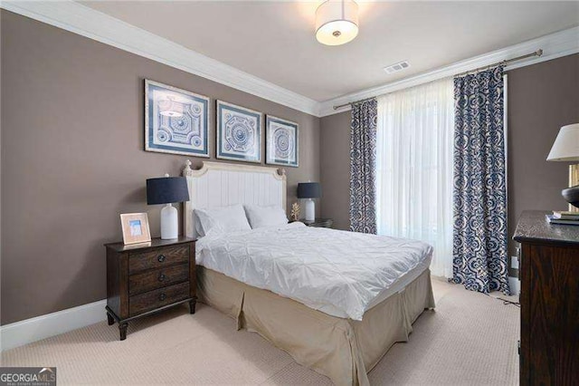 carpeted bedroom with ornamental molding