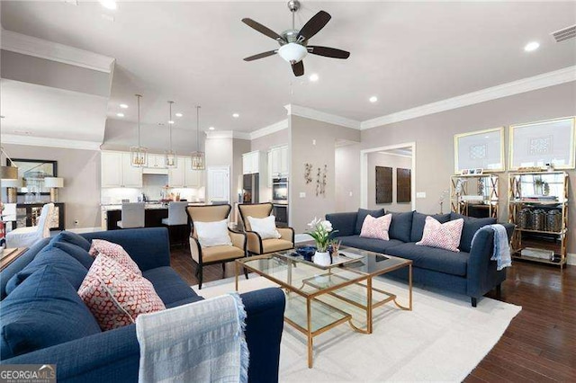 living room with ceiling fan, ornamental molding, and wood-type flooring