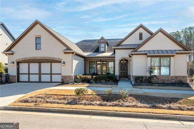 view of front of home with french doors and a garage