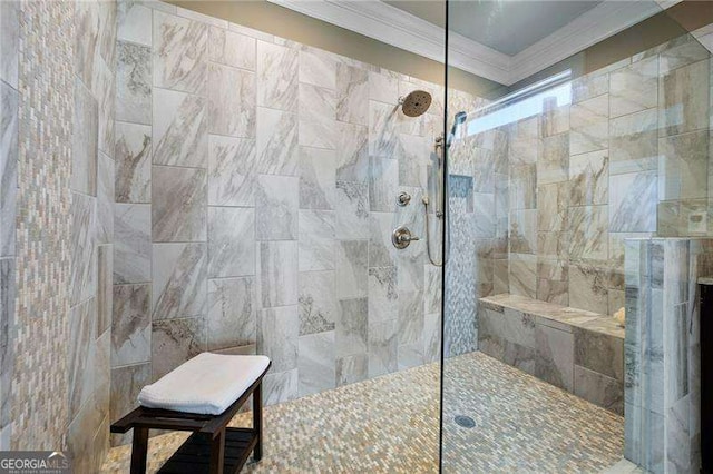 bathroom with a tile shower and ornamental molding