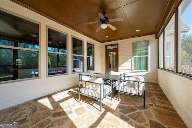 sunroom / solarium with ceiling fan