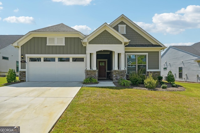 craftsman-style house featuring a garage and a front lawn