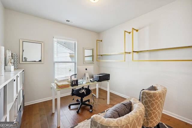 home office with wood-type flooring