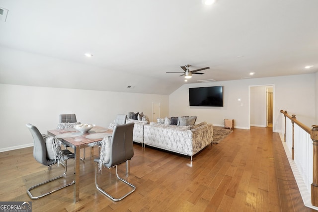 interior space featuring hardwood / wood-style floors, vaulted ceiling, and ceiling fan