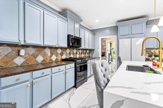 kitchen featuring range with gas stovetop, decorative light fixtures, sink, decorative backsplash, and dark stone counters