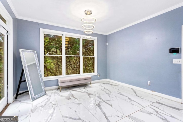 interior space with an inviting chandelier, plenty of natural light, and ornamental molding